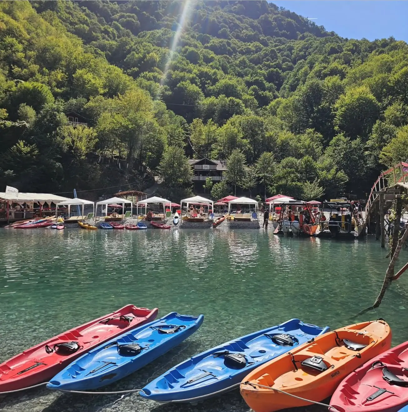 Kayaks and the riverside beach